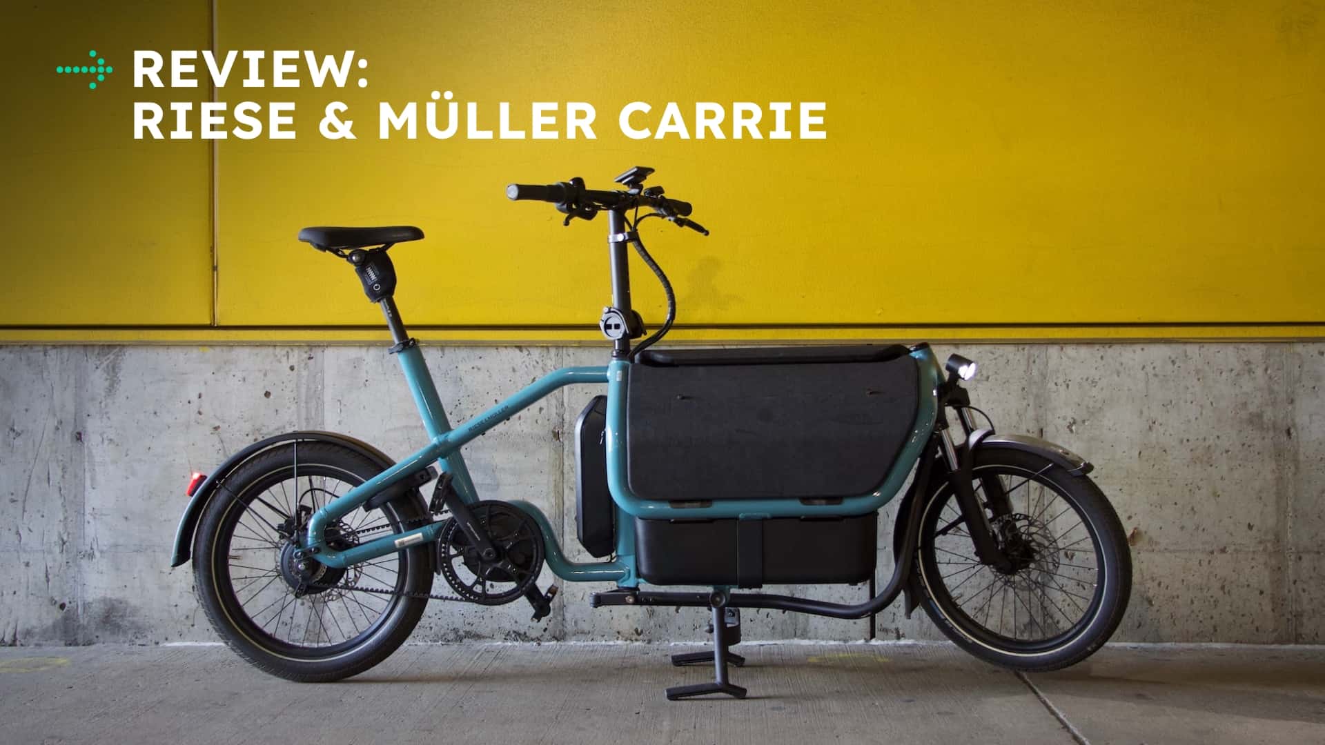 Riese & Müller Carrie elcykel parkeret foran en gul væg