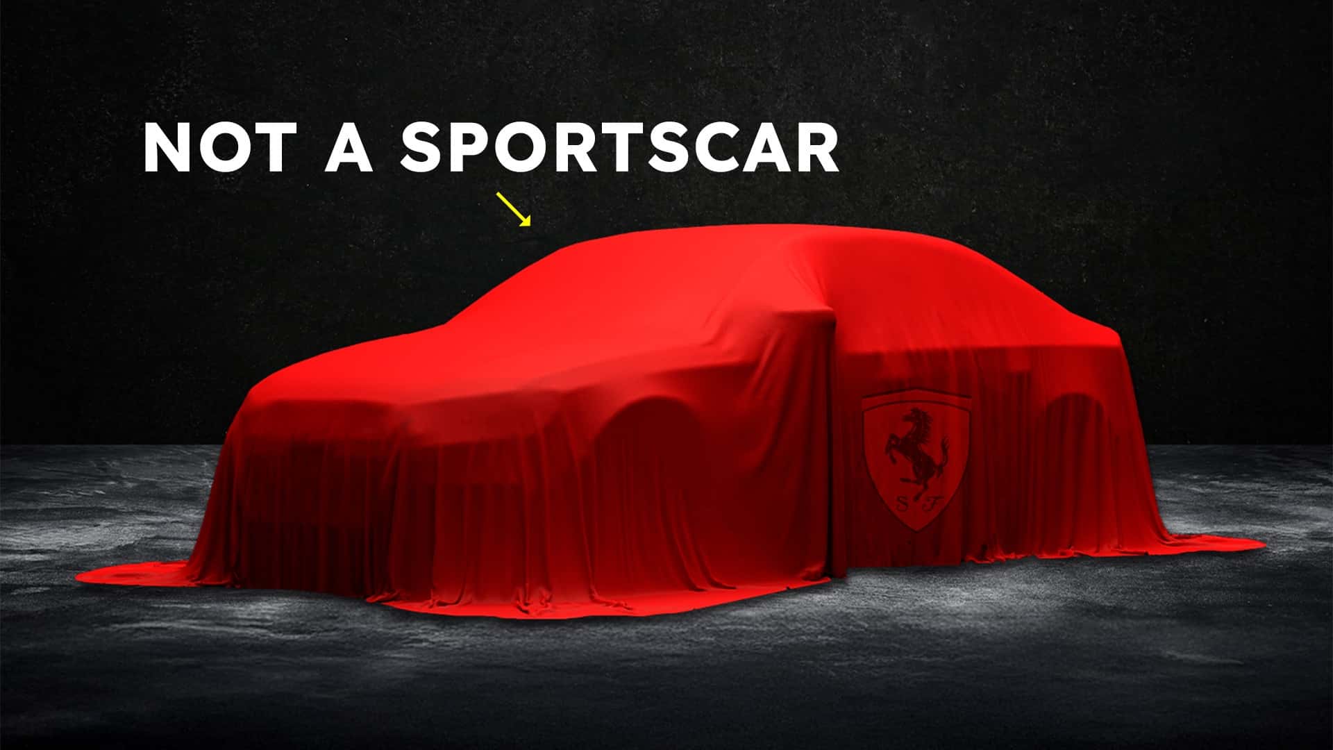 Bil dækket med rød stof med teksten 'Not a sportscar'