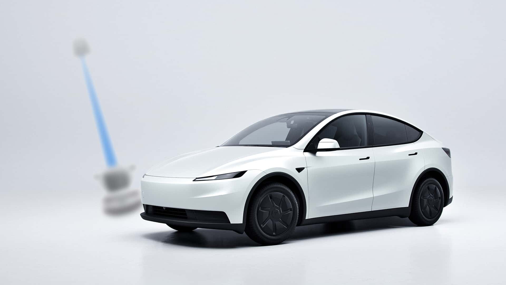 Hvid Tesla elbil i minimalistisk studieindstilling