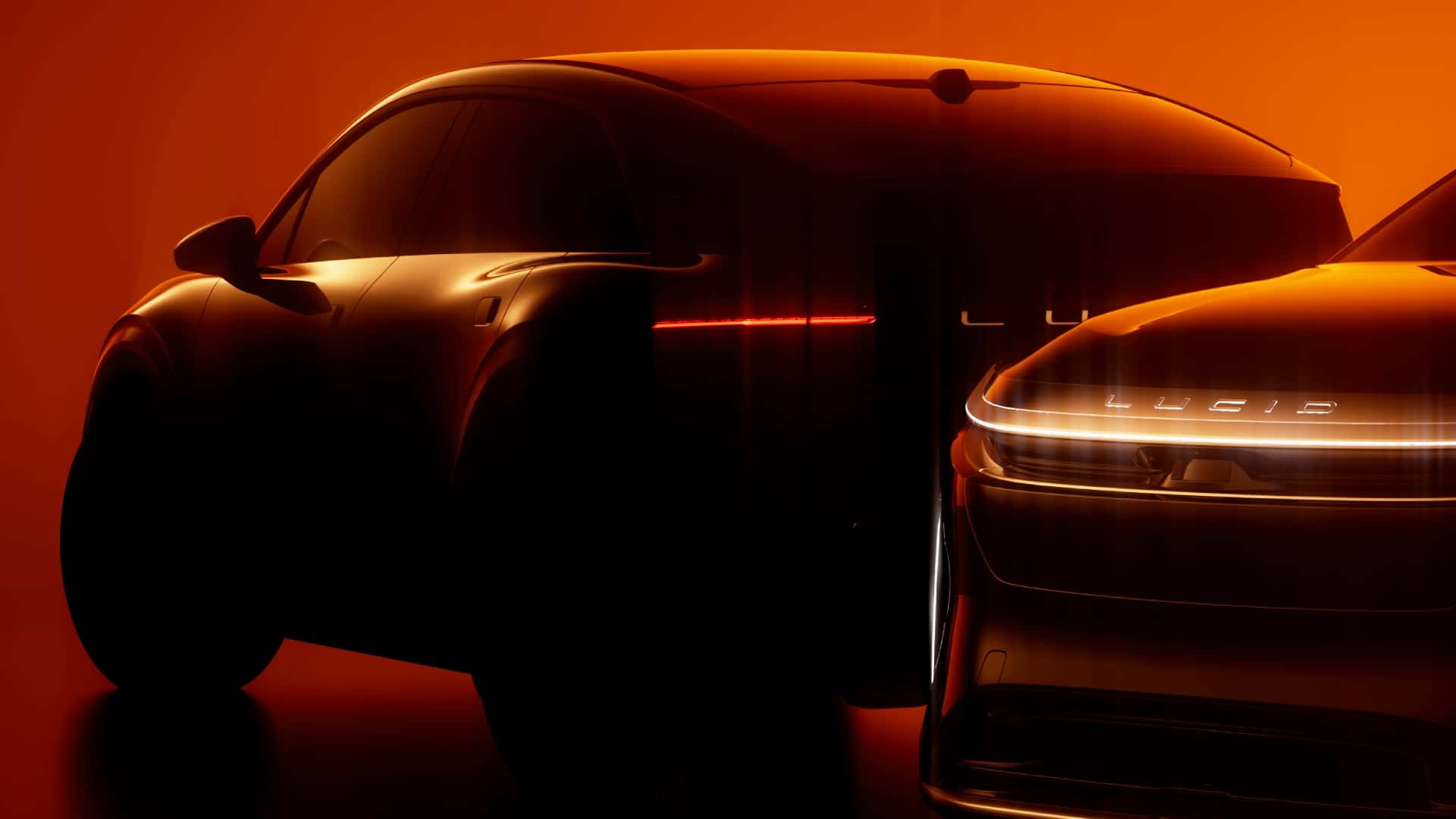 Elektriske biler med futuristisk design og oplyst logo i orange belysning