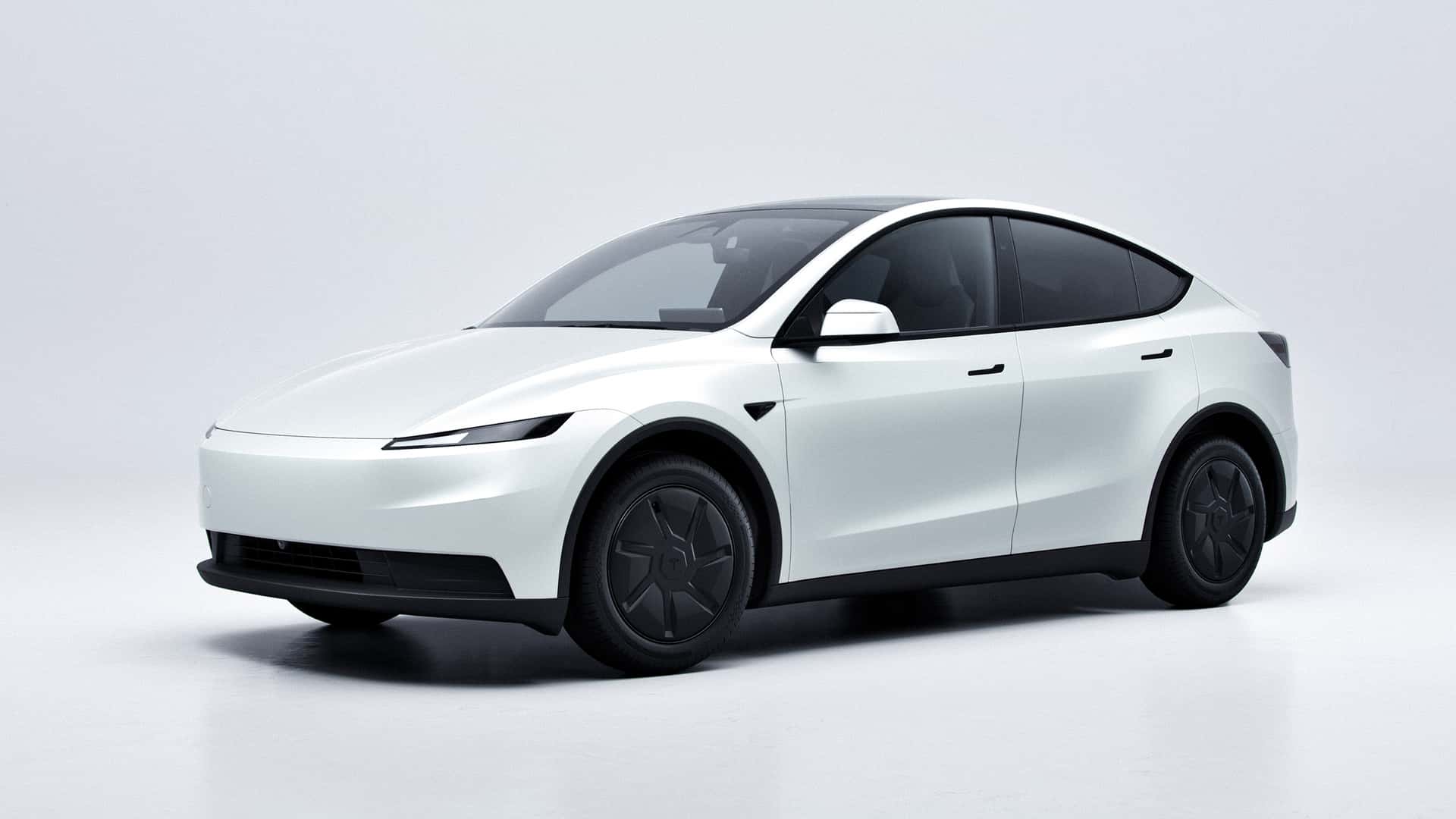 Hvid Tesla Model Y parkeret i et studiemiljø