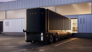 Selvkørende lastbil i Tesla design ved lagerbygning