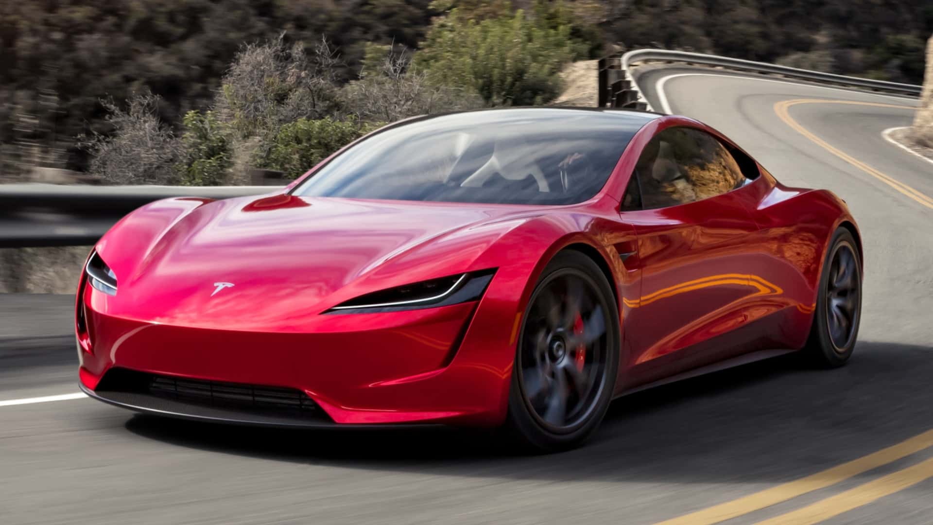 Tesla Roadster kører på snoet vej