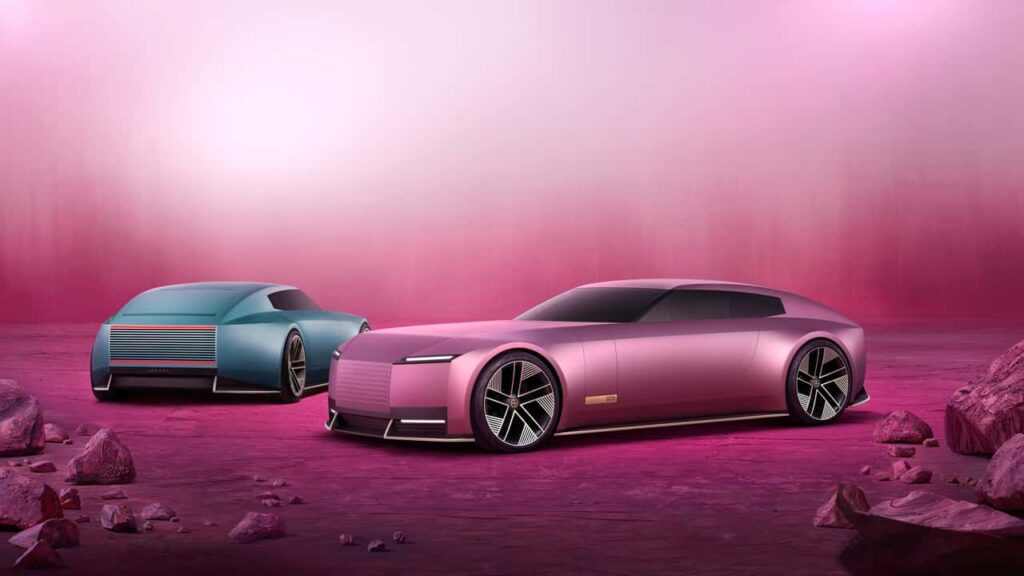 To futuristiske elektriske biler i pink og blå på en æterisk baggrund